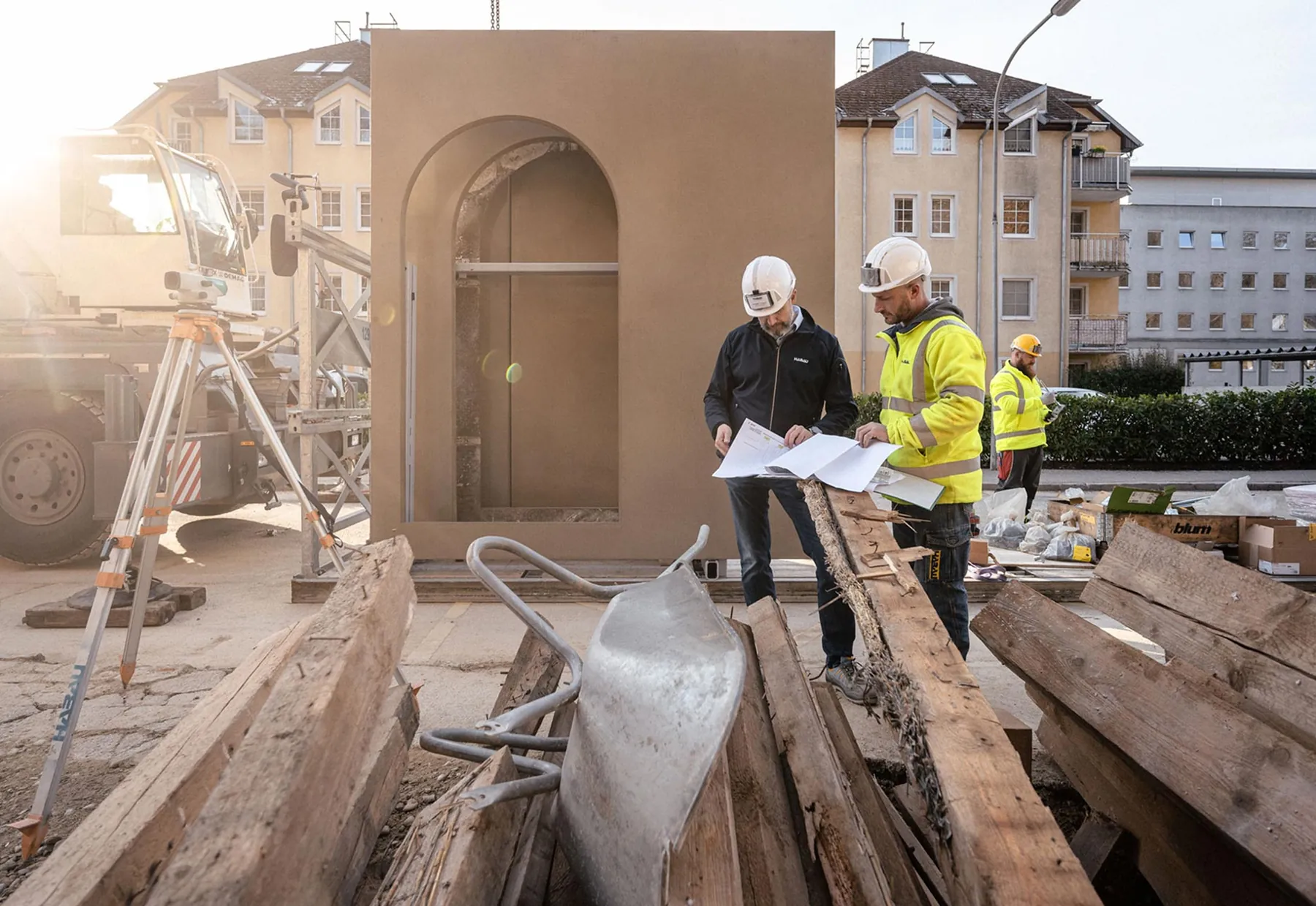 Engineers with a basalt-reinforced concrete façade panel on site