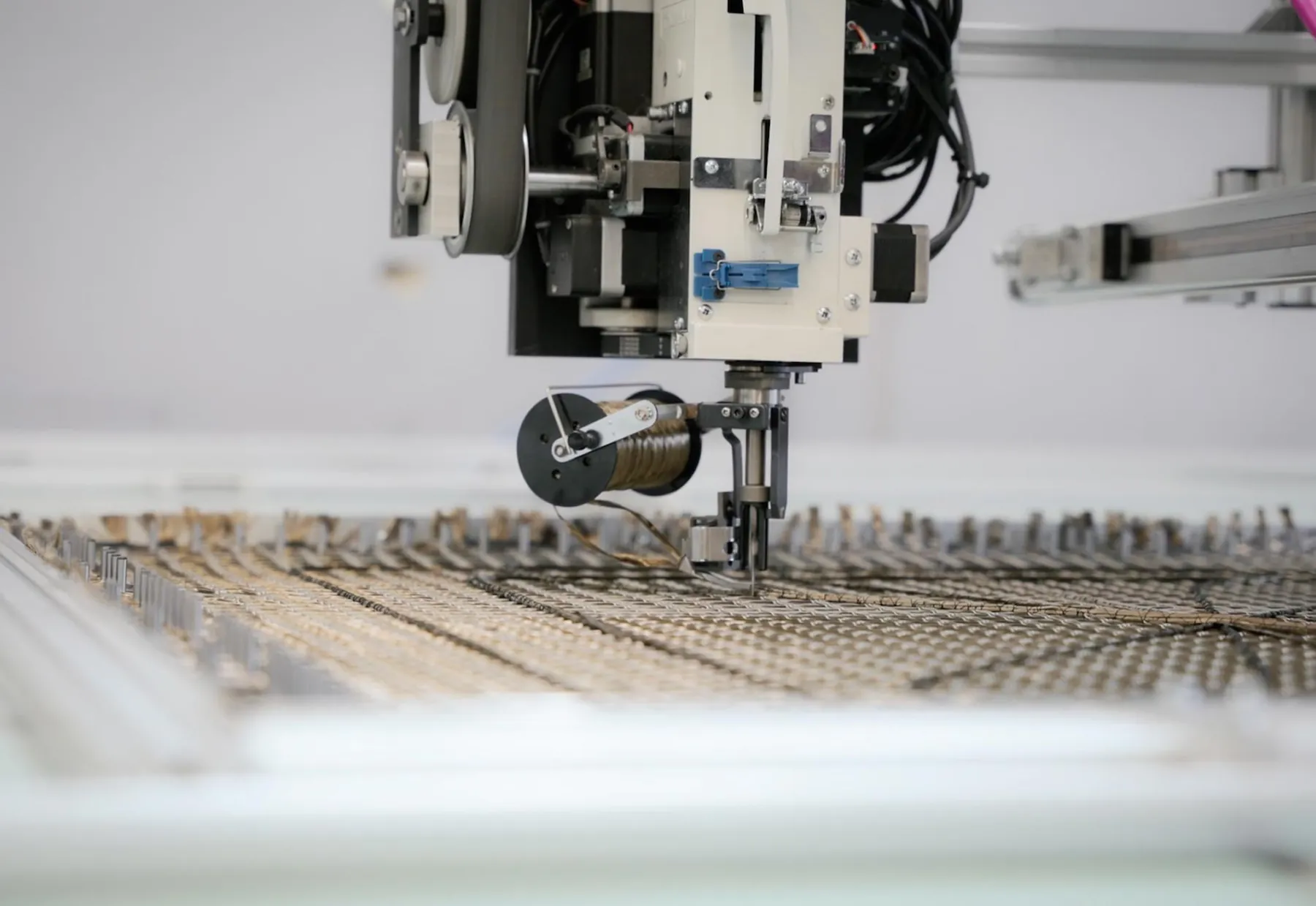 TFP stitching head working over a basalt fiber carrier